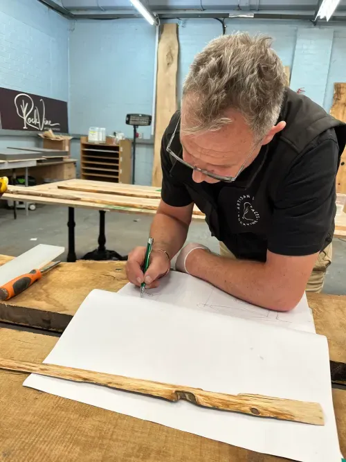Polished concrete dining table on U-frame welded steel base