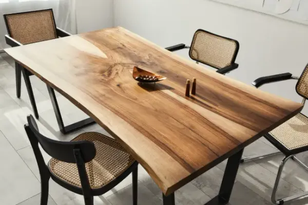Rectangular live edge dining table with straight natural timber slab